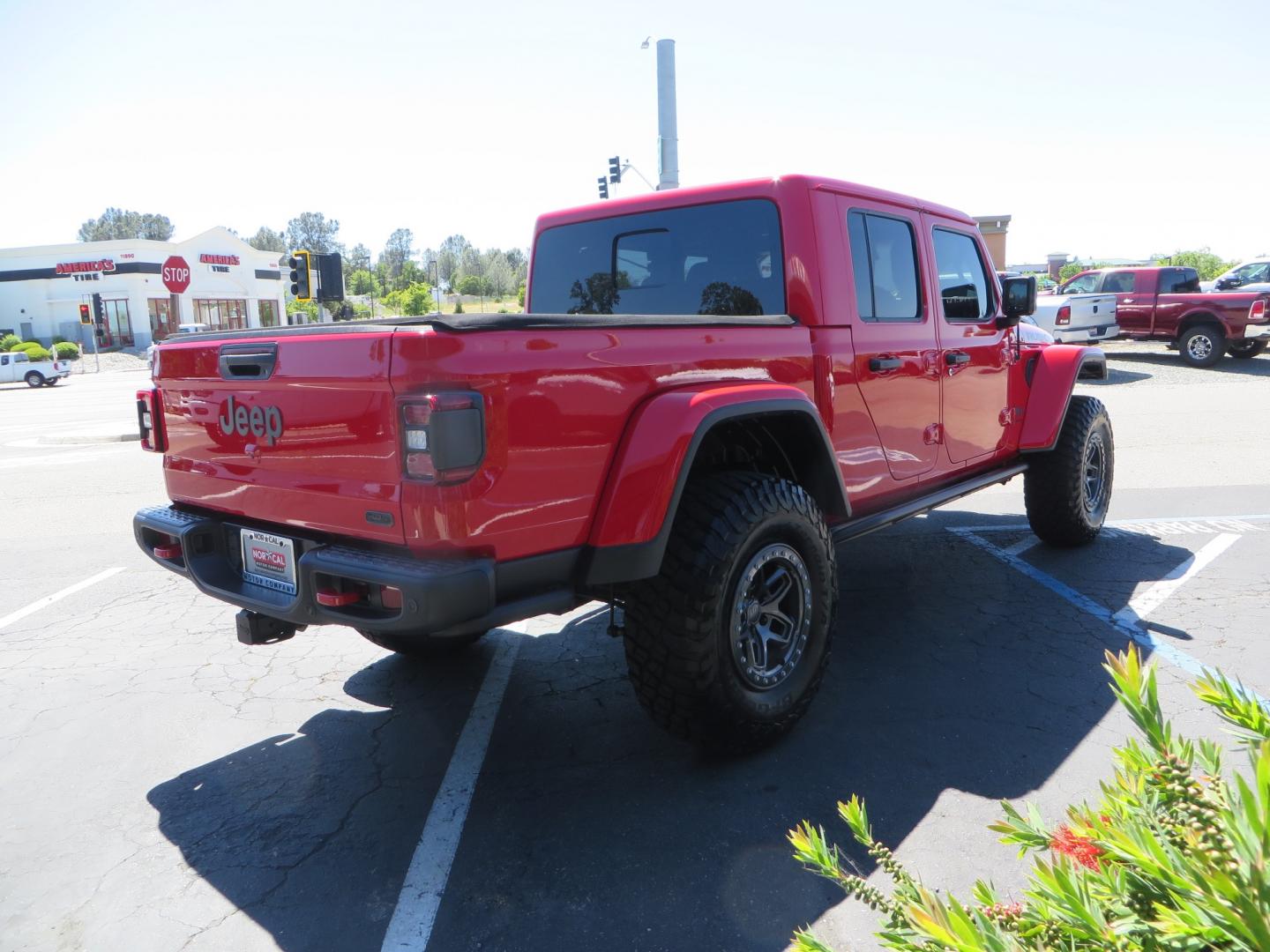 2020 Red /black Jeep Gladiator Rubicon (1C6JJTBG6LL) with an 3.6L V6 DOHC 24V engine, 6M transmission, located at 2630 Grass Valley Highway, Auburn, CA, 95603, (530) 508-5100, 38.937893, -121.095482 - Rubicon Gladiator featuring a Mopar suspension system with Fox shocks, 17" AEV wheels wrapped in 37" BFG tires, Warn Winch, Rock sliders, Cascade front license plate holder, Impact bedliner, Built Right Industries bed Molle panels, and Window tint. - Photo#4